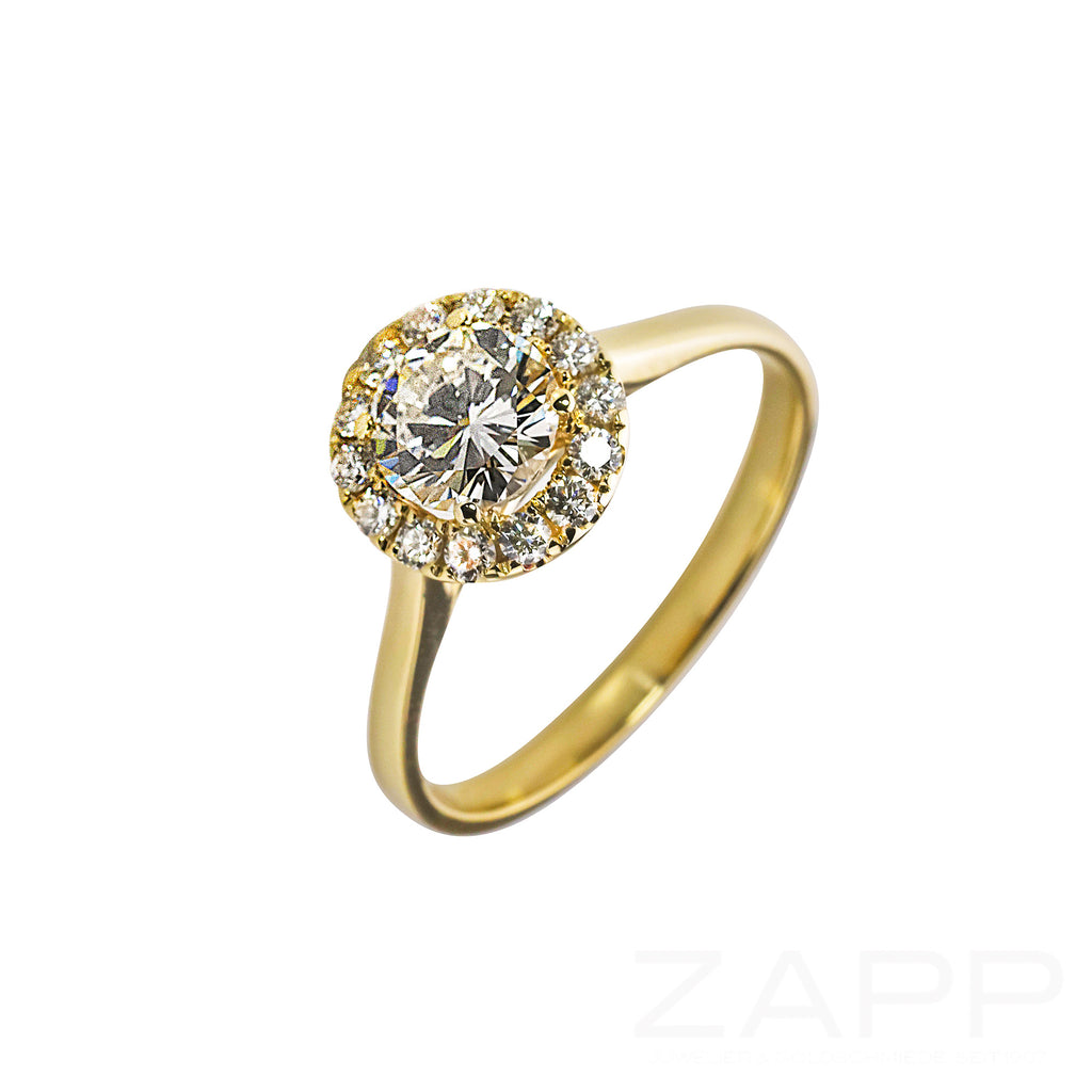 Ring aus 585 Gelbgold mit großem Brillanten und kleinen Brillanten